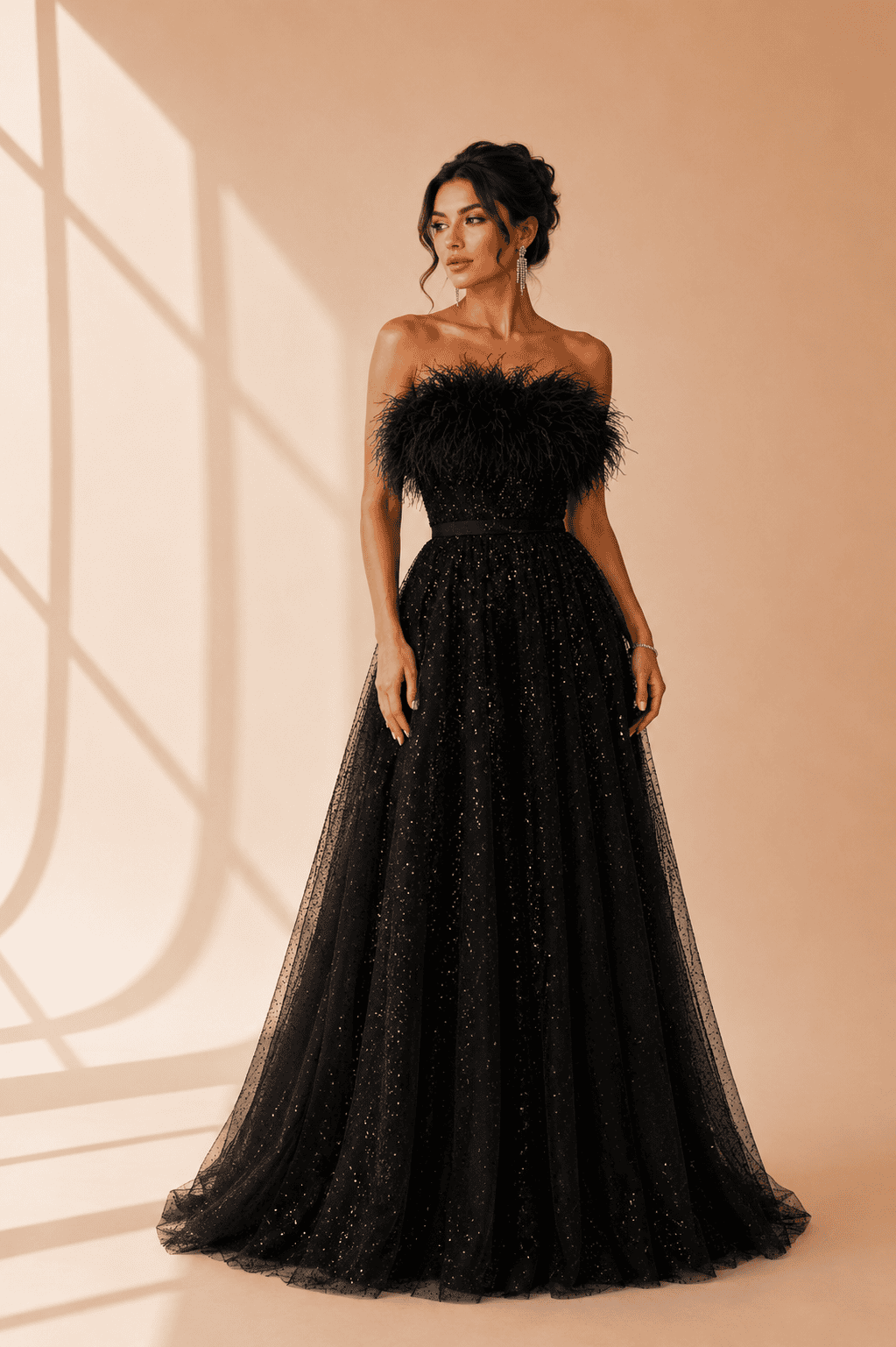 Elegant party dress with feather details at Afina Luxury in Hallandale Beach